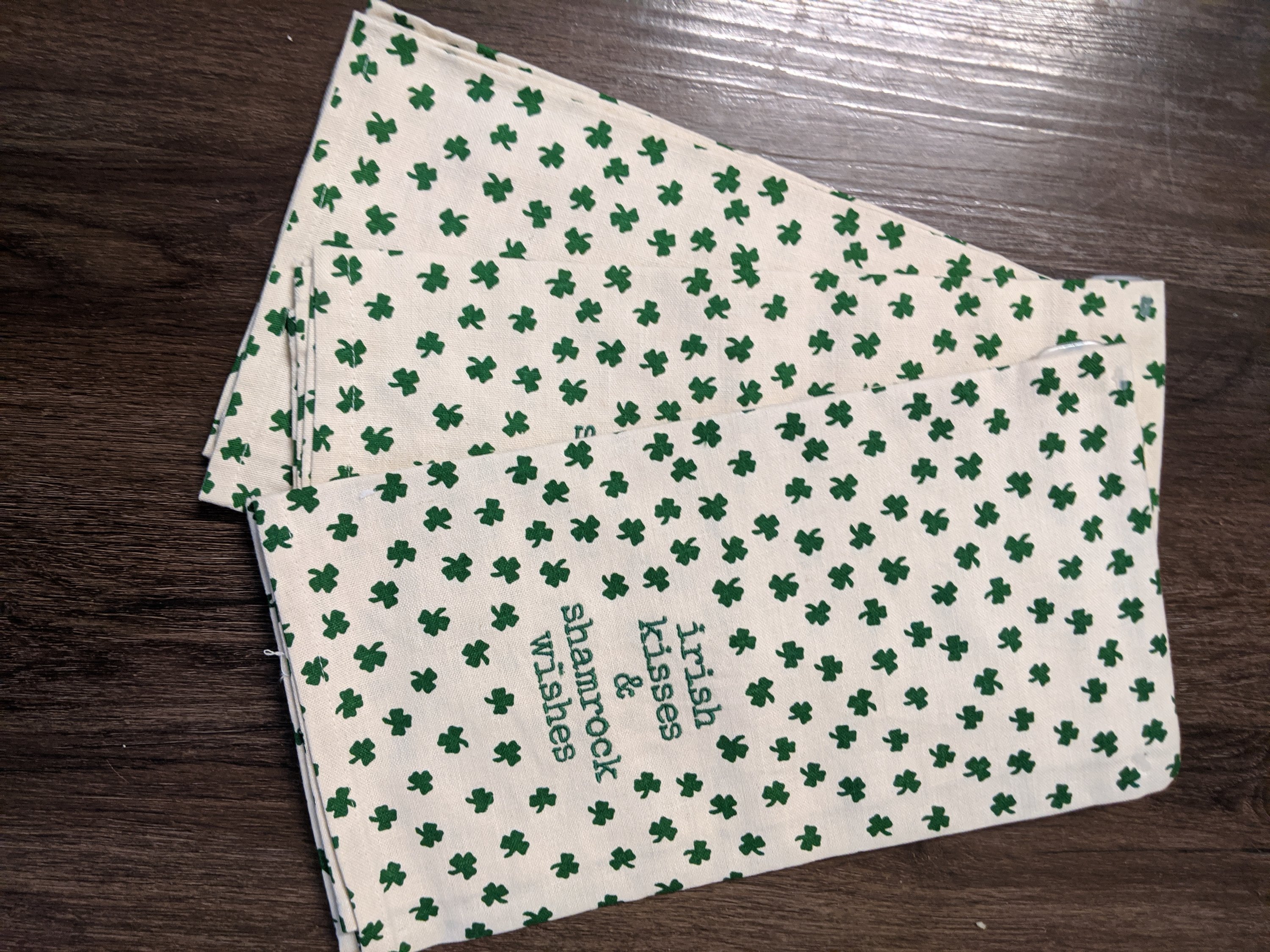 Irish Kisses and Shamrock Wishes Dish Towel featuring shamrocks and festive designs, perfect for St. Patrick's Day celebrations.